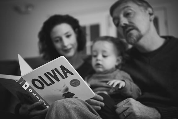 Family reading a book together