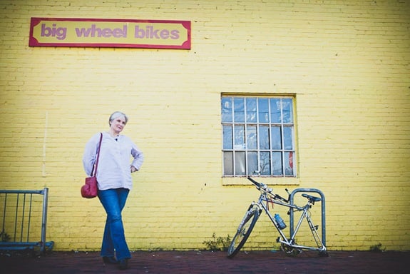 wide image of woman standing in old town alexandria