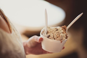 Engaged couple buying ice cream and coffee on a date