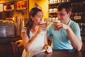 Engaged couple buying ice cream and coffee on a date