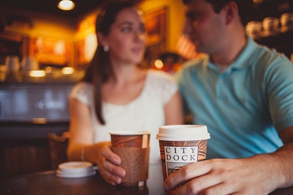 Engaged couple buying ice cream and coffee on a date