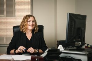 manager sitting at desk executive portrait