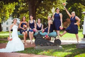 bridesmaids posing for wedding photo at naval academy