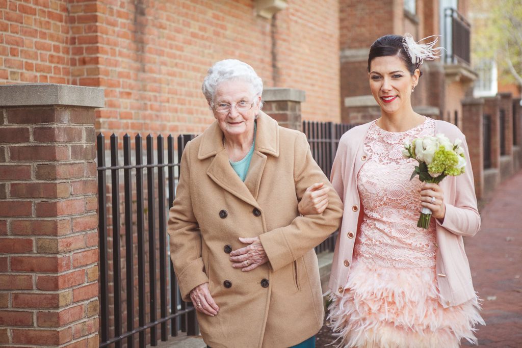 bride walking with grandmother after wedding ceremony