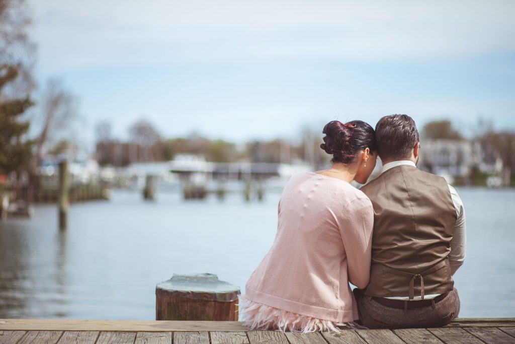 Bride and groom looking out over the water in Annapolis.