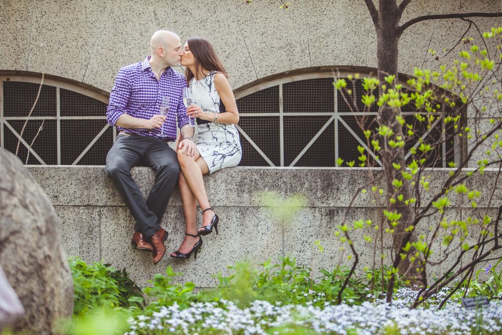 Engaged couple sharing a toast in DC.