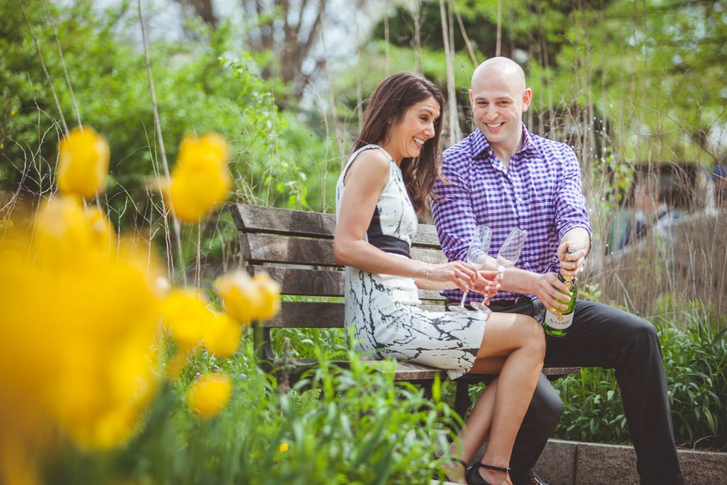 Engaged couple sharing a toast in DC.