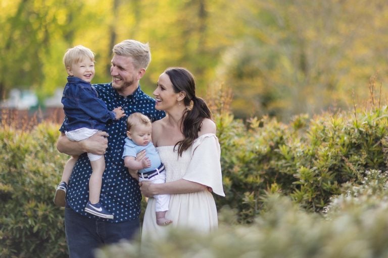 A family poses for a photo at Quiet Waters Park in Annapolis, Maryland.