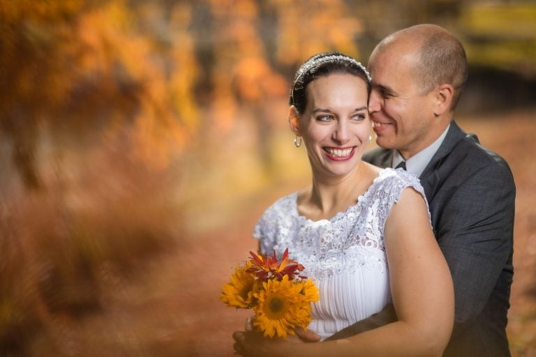 A bride and groom embracing in Quiet Waters Park, Annapolis.