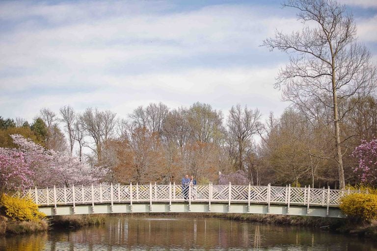 A couple standing on a bridge at Quiet Waters Park in Annapolis, Maryland.