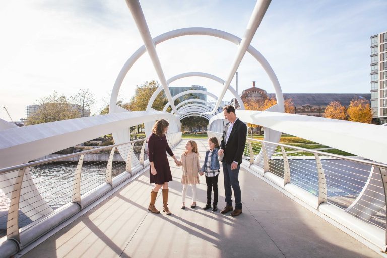 A family is standing on a bridge at Yards Park, Washington DC.