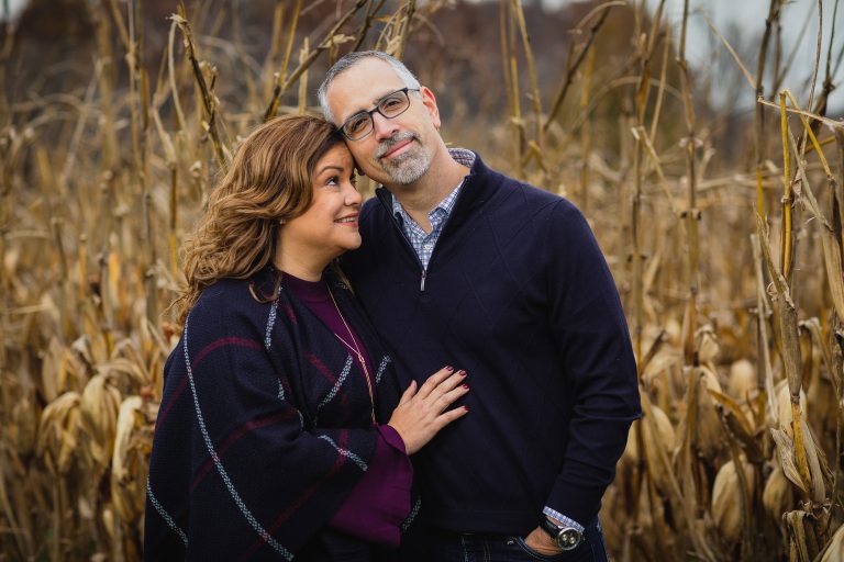 An engaged couple standing in Agricultural History Farm Park, Maryland.