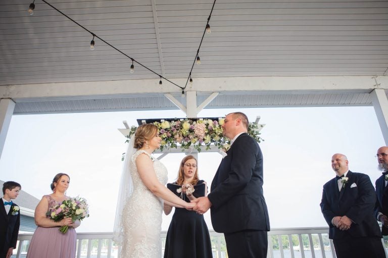 A bride and groom exchange vows at the Anchor Inn in Annapolis, Maryland.