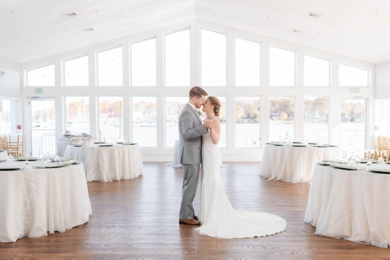 A bride and groom standing in the Anchor Inn, Annapolis, Maryland.