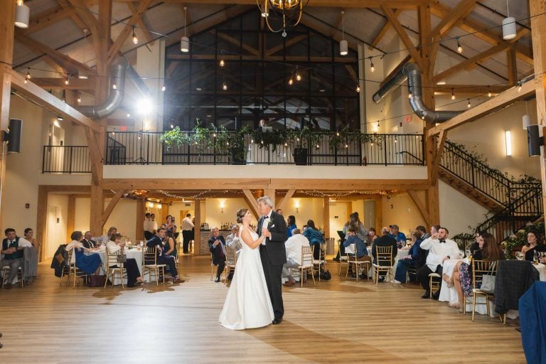 A bride and groom sharing their first dance in a barn at Atreeum at Soaring Timbers in Maryland near Annapolis.