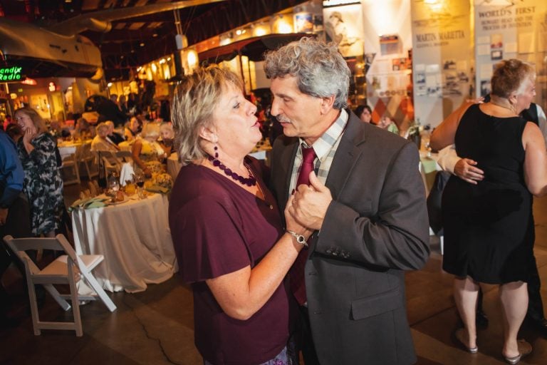 A man and woman dancing at a wedding reception in Baltimore Museum of Industry (Indoors).