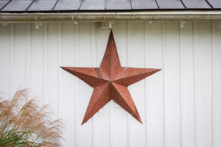 A metal star hangs on the side of a white barn at Barns at Hamilton Station Vineyards in Hamilton, Virginia.