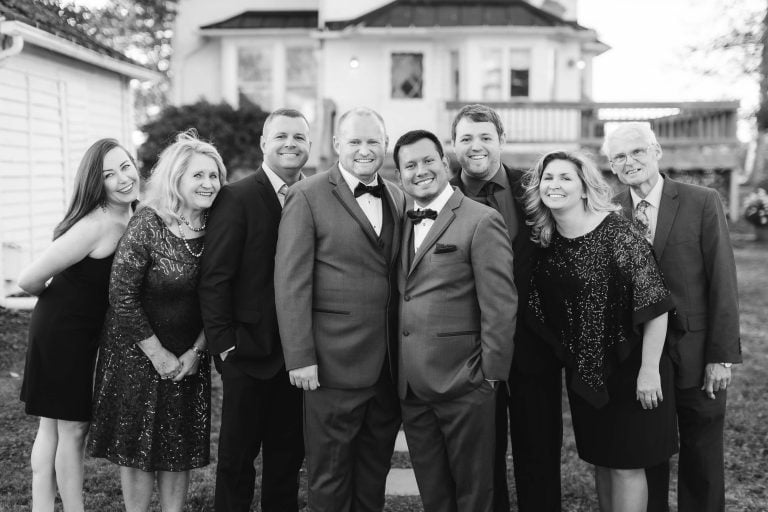 A group of people posing in front of the Barns at Hamilton Station Vineyards in Virginia.