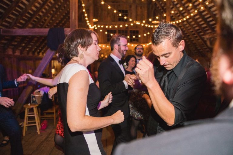 A group of people dancing at a wedding in Barns at Hamilton Station Vineyards.