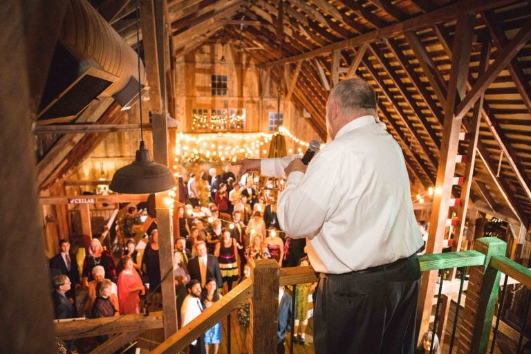 A man standing in a barn at Hamilton Station Vineyards in Virginia.