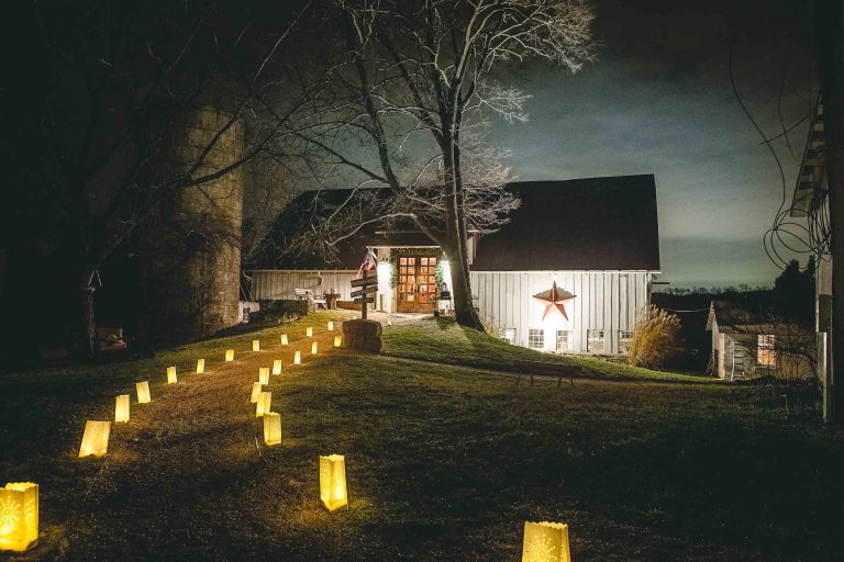 A path with candles leading to a barn at Hamilton Station Vineyards in Virginia.