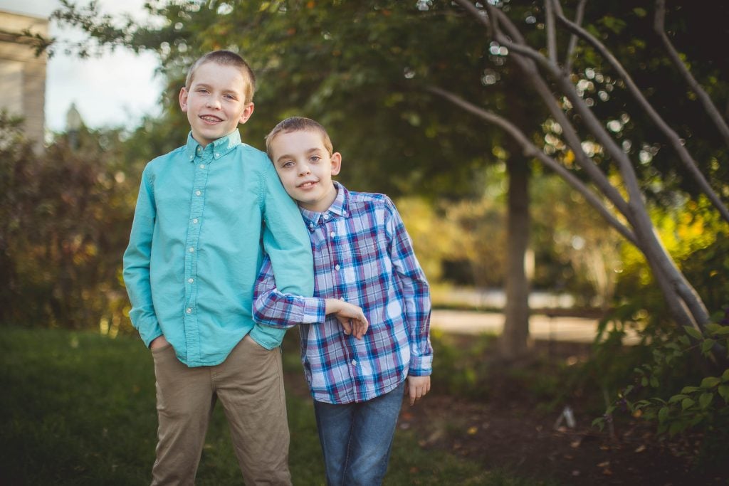 Two boys posing for a photo in Bartholdi Fountain & Gardens, Washington DC.