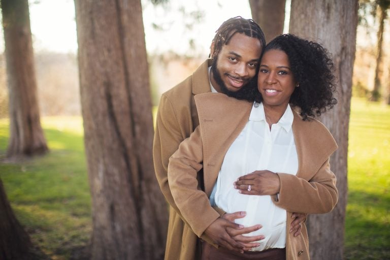 A Maryland couple posing in front of Belair Mansion.