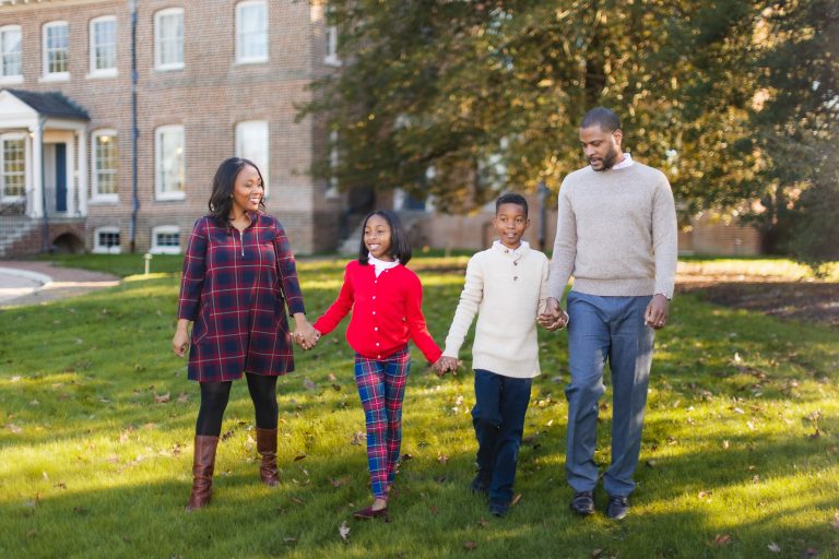 A family walks in front of Belair Mansion, Maryland.