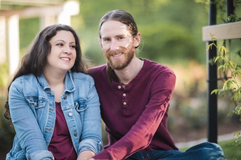 A couple sitting on a bench in the Bonair Rose Garden, Arlington, Virginia.