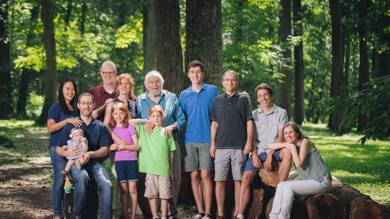 A family is posing for a photo in Cabin John Regional Park, Maryland.