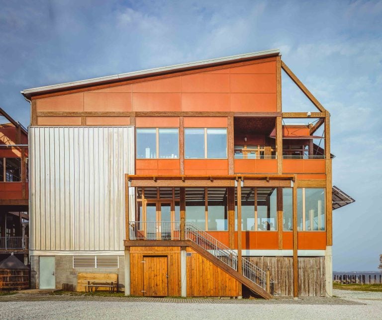 A house with a wooden deck and stairs located in Annapolis, Maryland.