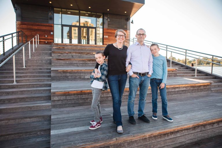 A family is standing on the steps of a building in Washington DC.