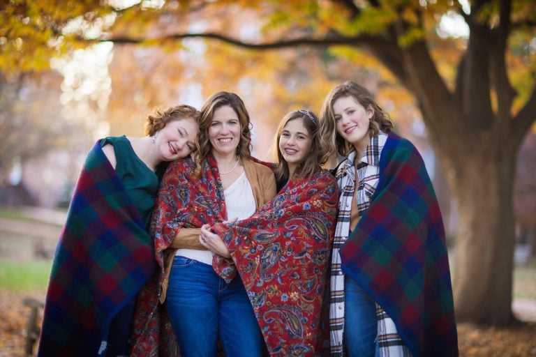 Three women wrapped in blankets in Downtown Annapolis.