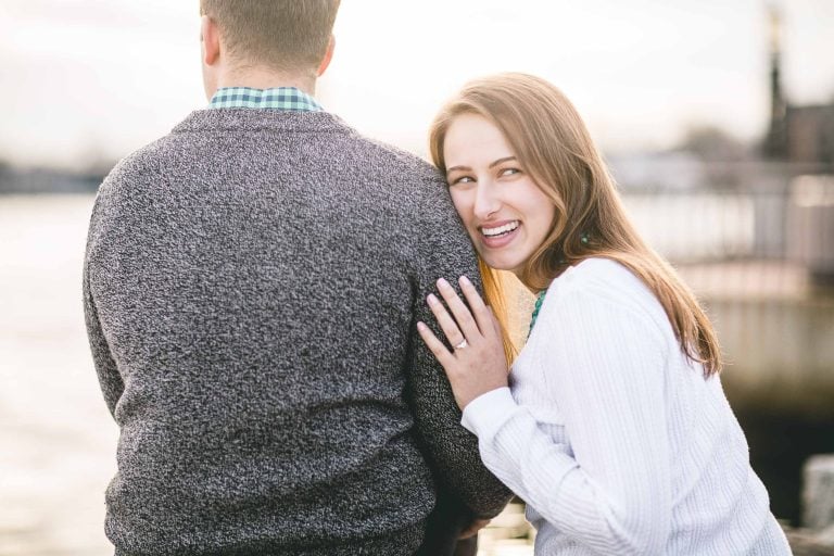 A man and woman are looking at each other while standing in Downtown Annapolis.