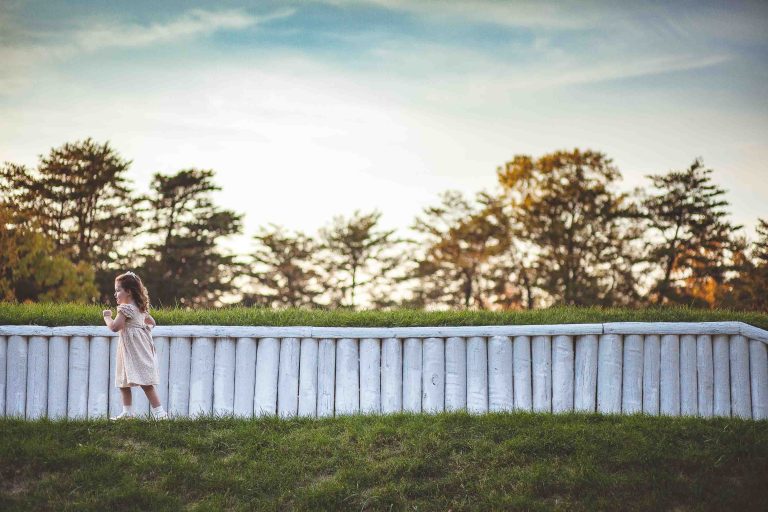 A woman is standing in Fort Ward Park in Virginia.