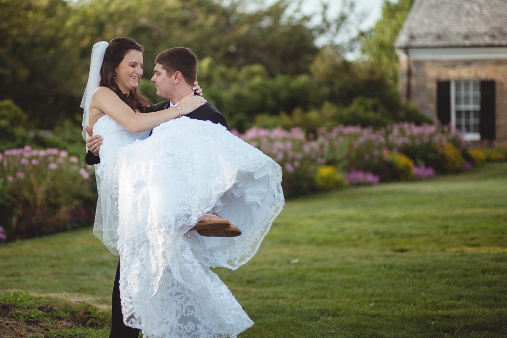 A bride and groom are holding each other at Glenview Mansion in Rockville, Maryland.