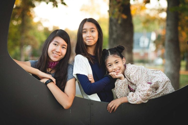 Three Asian girls posing for a photo in Glenview Mansion, Maryland.