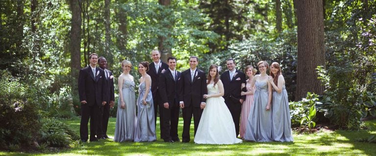 A wedding party posing for a photo at Gramercy Mansion in Maryland.