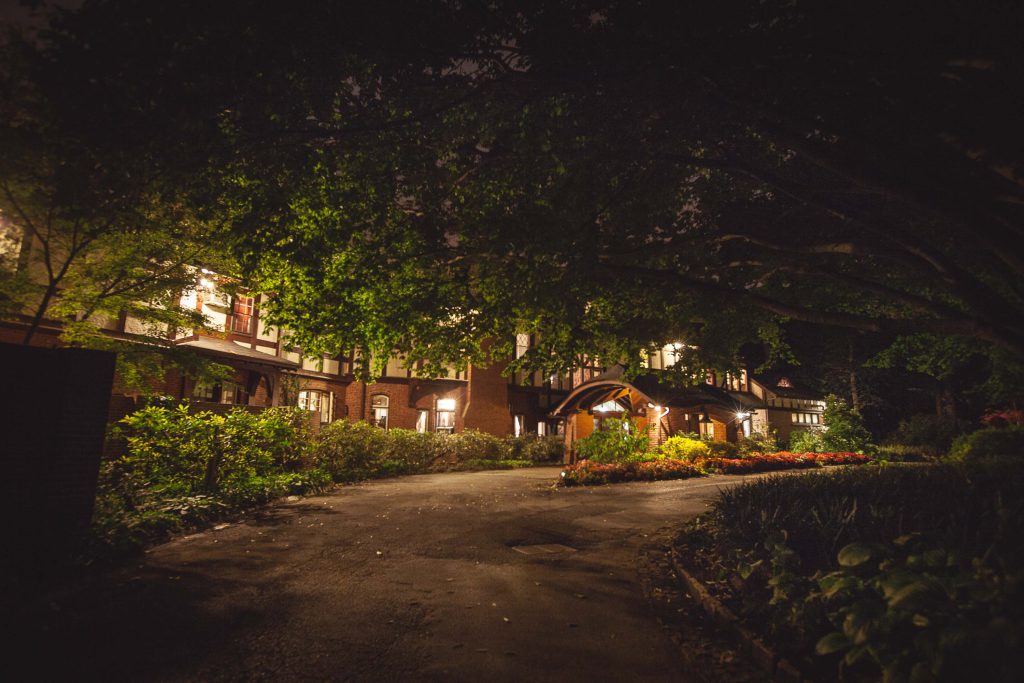 The Gramercy Mansion in Maryland is lit up at night.