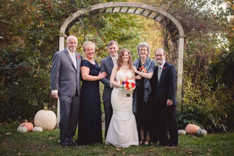 A group of people posing for a photo in Historic Baldwin Hall garden, Maryland.