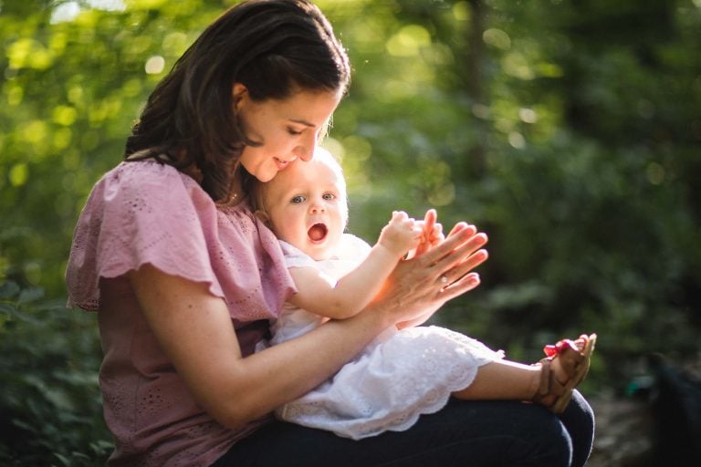 A woman holding a baby at Irvine Nature Center.