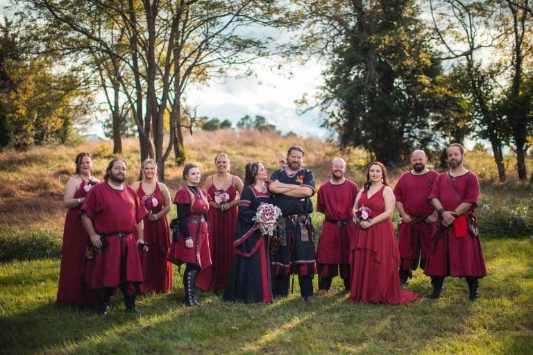 A group of people in red costumes posing for a photo at Jefferson-Patterson Park in Maryland.