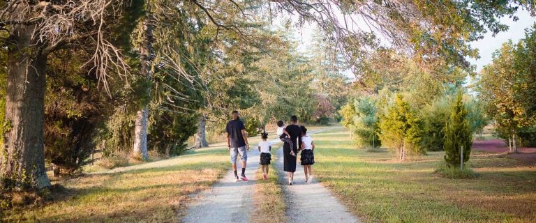 A family is walking down a path near Crofton in Maryland.