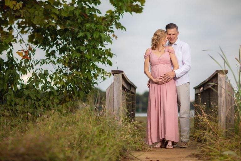 A pregnant couple standing in Jonas and Anne Catharine Green Park.