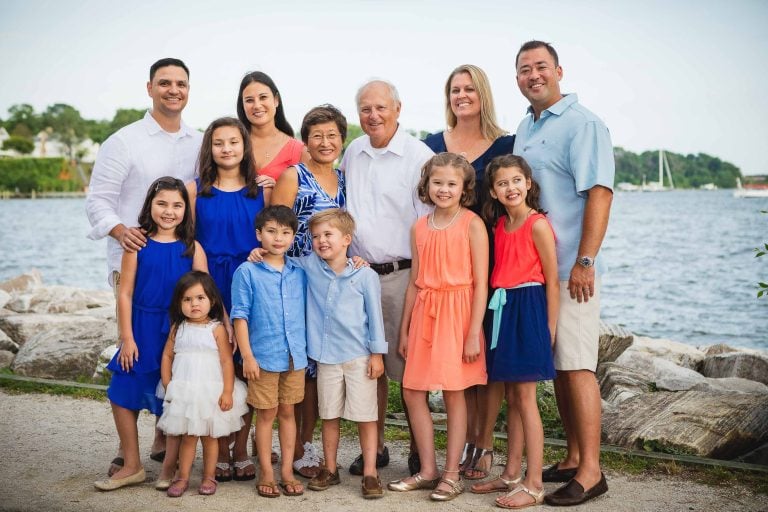 A family is posing for a photo near Jones Point Park in Alexandria, Virginia.