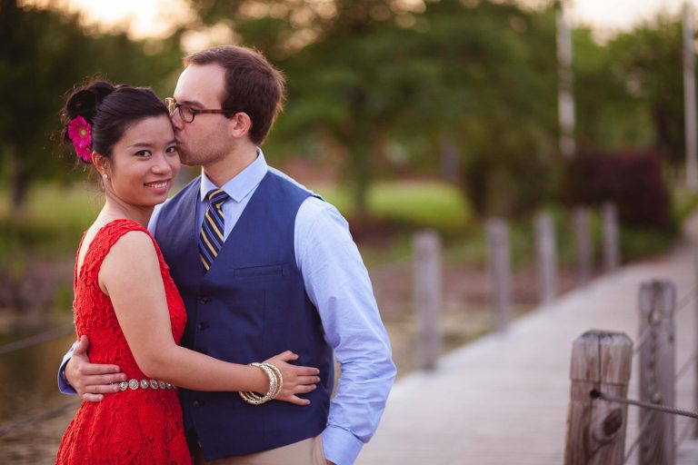 A man and woman hugging on a dock in College Park.