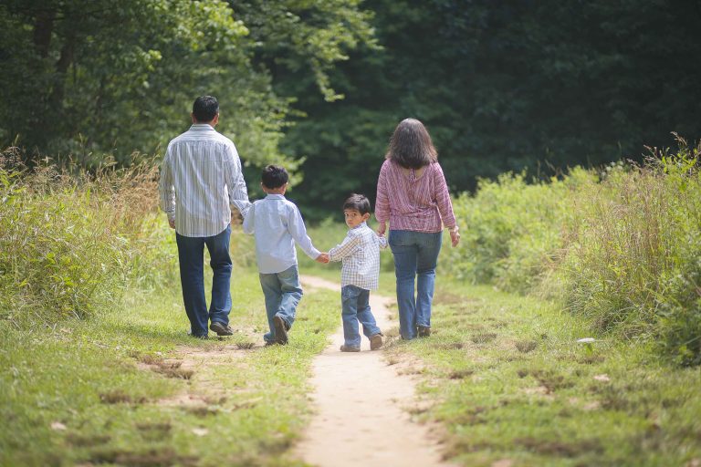 A family walking down a path at Locust Grove Nature Center in Bethesda, Maryland.