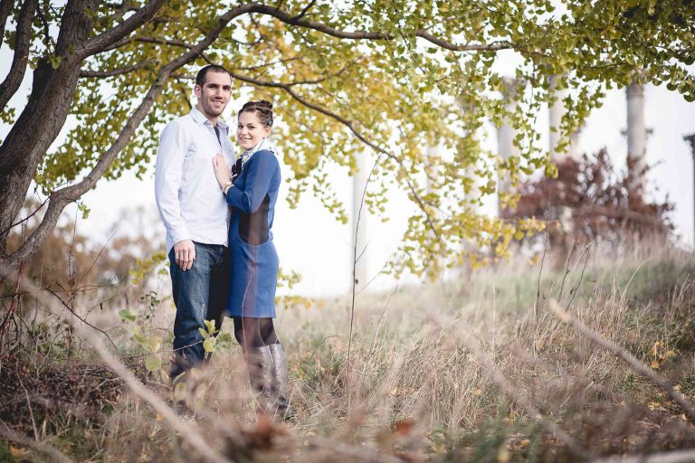 A couple standing under a tree in the National Arboretum.