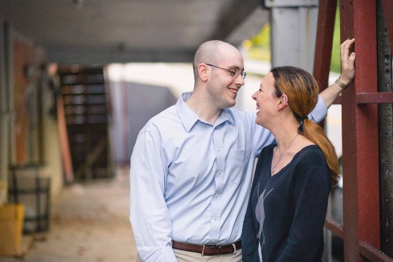 A man and woman are standing next to each other in Historic Savage Mill.