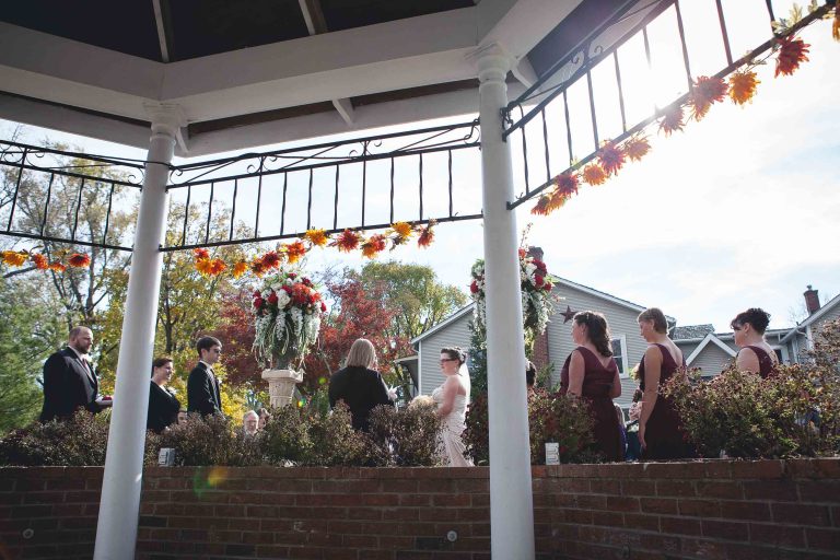 A wedding ceremony at the Manor at Silo Falls in Brookeville, Maryland, with fall decorations.